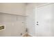 Bright laundry room with a shelf, utility connections, and a convenient door at 1801 W Nighthawk Way, Phoenix, AZ 85045