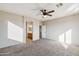 Spacious primary bedroom features a ceiling fan, and entry to the en suite bathroom with dual sinks at 1801 W Nighthawk Way, Phoenix, AZ 85045