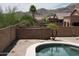 Backyard showcasing a pool with desert landscaping and privacy wall at 1801 W Nighthawk Way, Phoenix, AZ 85045