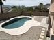 Backyard pool with rock landscaping, desert foliage, stone pavers, and mountain views at 1801 W Nighthawk Way, Phoenix, AZ 85045
