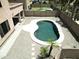 Aerial view of private pool with stone pavers, desert landscaping, and patio at 1801 W Nighthawk Way, Phoenix, AZ 85045