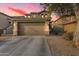 Two-story house with a two-car garage and desert landscaping at 18320 N Betty Ct, Maricopa, AZ 85138