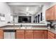 Kitchen with view into living area, stainless steel sink and appliances at 18320 N Betty Ct, Maricopa, AZ 85138