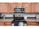 Modern kitchen features stainless steel appliances and ample cabinetry at 18320 N Betty Ct, Maricopa, AZ 85138