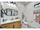 Charming bathroom features a beadboard framed mirror, modern lighting and ample counter space at 18831 E Augusta Ave, Queen Creek, AZ 85142