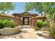 Inviting community entrance with stonework and pergola at 20750 N 87Th St # 1065, Scottsdale, AZ 85255