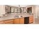 Kitchen boasts a double sink, dishwasher, and light wood cabinets at 20750 N 87Th St # 1065, Scottsdale, AZ 85255