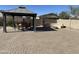 Backyard patio with gazebo, fire pit, and seating area at 2171 N Santiana Pl, Casa Grande, AZ 85122