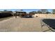Spacious backyard with a patio, gazebo, fire pit, and trampoline at 2171 N Santiana Pl, Casa Grande, AZ 85122