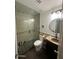Updated bathroom with a glass shower, granite vanity, and modern fixtures at 2171 N Santiana Pl, Casa Grande, AZ 85122