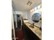 Bathroom with granite countertop, copper sink, and walk-in shower at 2171 N Santiana Pl, Casa Grande, AZ 85122