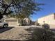 House exterior featuring a two-car garage and a gravel driveway at 2171 N Santiana Pl, Casa Grande, AZ 85122