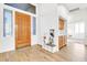 Light and airy entryway with wood floors and built-in shelving at 2303 E San Tan St, Chandler, AZ 85225