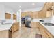 Kitchen with stainless steel appliances and light wood cabinets at 2303 E San Tan St, Chandler, AZ 85225