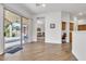 Living room with view into kitchen and access to backyard patio at 2303 E San Tan St, Chandler, AZ 85225