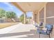 Relaxing covered patio with seating and yard views at 2303 E San Tan St, Chandler, AZ 85225