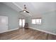 Spacious bedroom with wood-look floors and sliding glass door to patio at 2329 N Recker Rd # 23, Mesa, AZ 85215