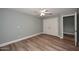 Bedroom with double-door closet and wood-look floors at 2329 N Recker Rd # 23, Mesa, AZ 85215