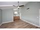 Primary bedroom with wood-look floors and updated vanity at 2329 N Recker Rd # 23, Mesa, AZ 85215