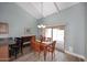 Dining area with a wooden table, chairs, and access to a patio at 2329 N Recker Rd # 23, Mesa, AZ 85215