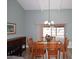 Bright dining room with a wooden table and access to a back patio at 2329 N Recker Rd # 23, Mesa, AZ 85215