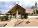 Wooden gazebo with a covered roof, located in a landscaped area at 2329 N Recker Rd # 23, Mesa, AZ 85215