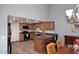 Kitchen with wood cabinets, stainless steel appliances, and a breakfast bar at 2329 N Recker Rd # 23, Mesa, AZ 85215