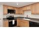 Modern kitchen with stainless steel appliances and light wood cabinets at 2329 N Recker Rd # 23, Mesa, AZ 85215
