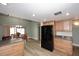 Eat-in kitchen with black appliances and wood cabinets at 2329 N Recker Rd # 23, Mesa, AZ 85215