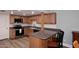Updated kitchen featuring wood cabinets and stainless steel appliances at 2329 N Recker Rd # 23, Mesa, AZ 85215