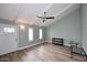 Living area featuring wood-look floors, vaulted ceilings, and a neutral color scheme at 2329 N Recker Rd # 23, Mesa, AZ 85215