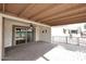 Covered patio with brick pavers, seating area, and sliding glass doors at 2329 N Recker Rd # 23, Mesa, AZ 85215