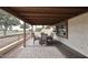 Covered patio with brick pavers, seating area, and golf course view at 2329 N Recker Rd # 23, Mesa, AZ 85215