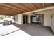 Covered patio with brick pavers, seating area, and sliding glass doors at 2329 N Recker Rd # 23, Mesa, AZ 85215