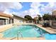 Community pool and spa with lounge chairs and surrounding fence at 2329 N Recker Rd # 23, Mesa, AZ 85215