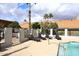 Pool area with lounge chairs and gate access at 2329 N Recker Rd # 23, Mesa, AZ 85215