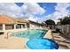 Community pool and spa with lounge chairs and surrounding fence at 2329 N Recker Rd # 23, Mesa, AZ 85215