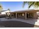 Backyard patio with seating area and covered pergola at 23610 S Desert Moon Ct, Sun Lakes, AZ 85248