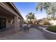 Spacious backyard patio with seating area, perfect for outdoor entertaining at 23610 S Desert Moon Ct, Sun Lakes, AZ 85248