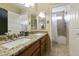 Bathroom with granite double vanity and large shower/tub at 23610 S Desert Moon Ct, Sun Lakes, AZ 85248