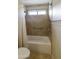 Clean bathroom with a shower/tub combo and grab bars at 23610 S Desert Moon Ct, Sun Lakes, AZ 85248