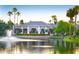 Scenic community lake with clubhouse reflection and fountain at 23610 S Desert Moon Ct, Sun Lakes, AZ 85248
