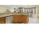 Kitchen island with granite countertop and double sink at 23610 S Desert Moon Ct, Sun Lakes, AZ 85248