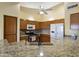 Modern kitchen with granite counters, stainless steel appliances, and breakfast bar at 23610 S Desert Moon Ct, Sun Lakes, AZ 85248