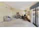 Bright living room with comfortable furniture and access to backyard at 23610 S Desert Moon Ct, Sun Lakes, AZ 85248