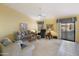 Cozy living room featuring comfortable seating and patio access at 23610 S Desert Moon Ct, Sun Lakes, AZ 85248