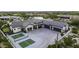 Aerial view of a home with a large driveway and pickleball court at 25582 N 89Th St, Scottsdale, AZ 85255