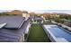 Aerial view showcasing a home with a pool, grassy backyard, and mountain backdrop at 25582 N 89Th St, Scottsdale, AZ 85255