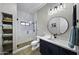 Modern bathroom with a walk-in shower, hexagon tile flooring, and navy blue vanity at 25582 N 89Th St, Scottsdale, AZ 85255