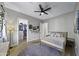 Bright bedroom with wood flooring, walk-in closet, and ceiling fan at 25582 N 89Th St, Scottsdale, AZ 85255